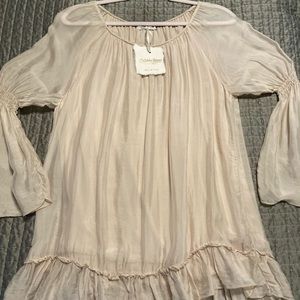 Italian silk blouse with bell sleeves and ruffle shirttail. Beautiful bone color